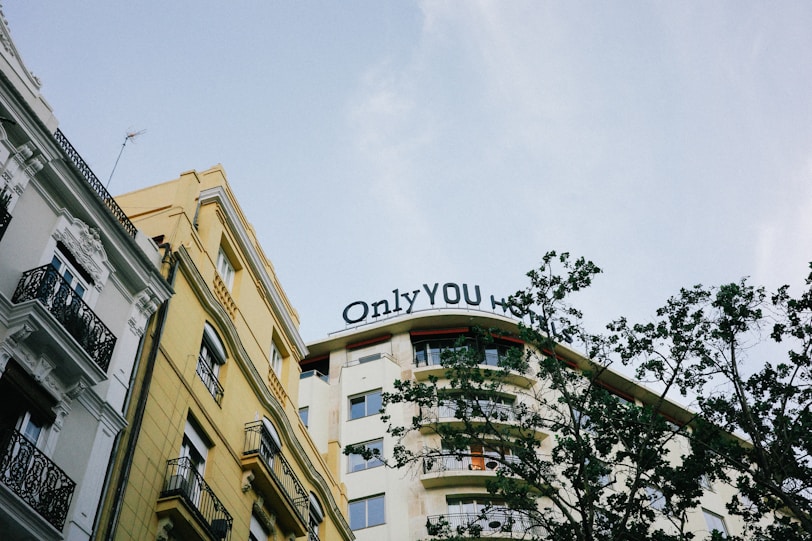 A tall building with a sign that says only you