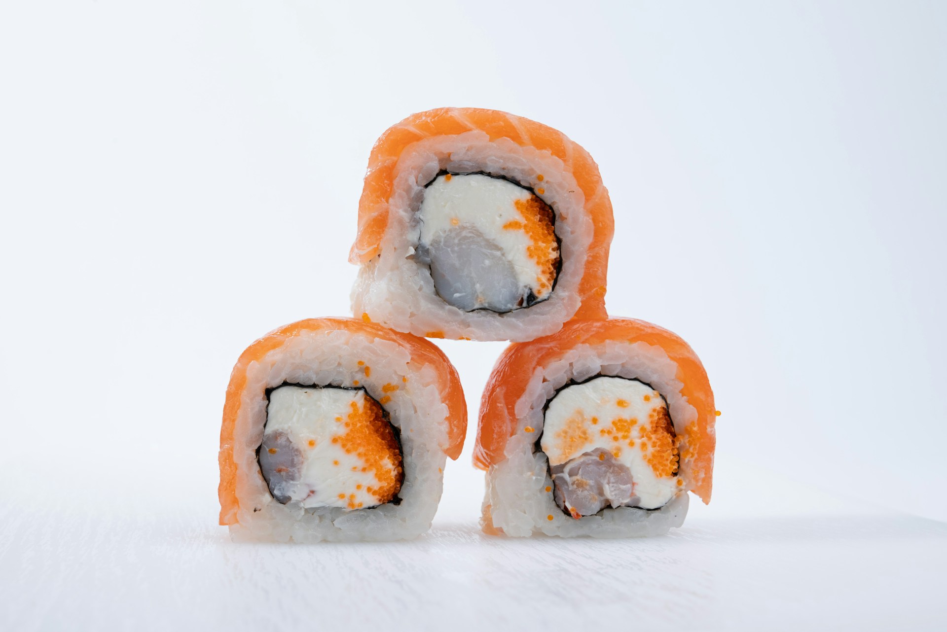 Four pieces of sushi stacked on top of each other