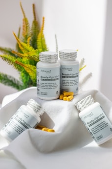A bunch of pills sitting on top of a white cloth