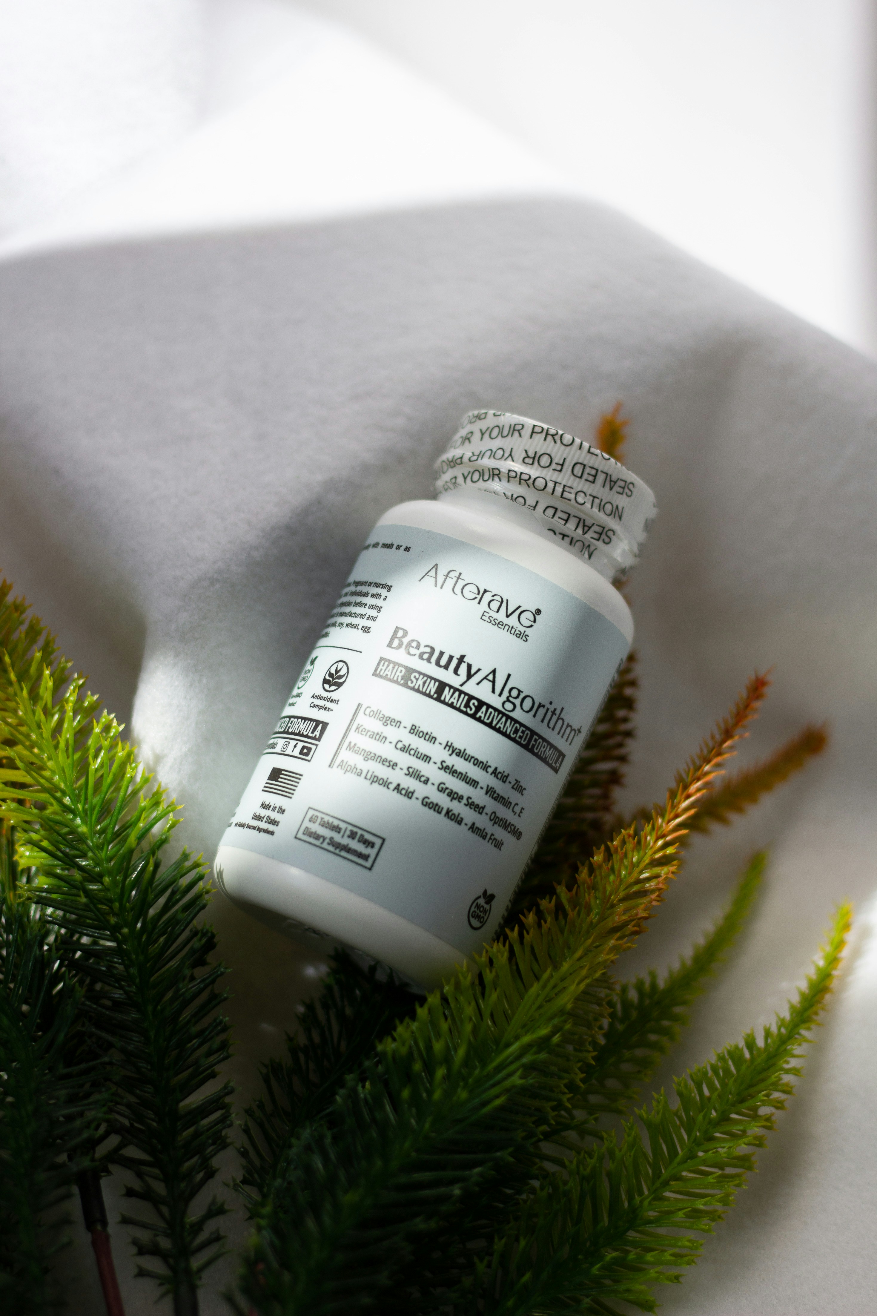 A close up of a bottle of medicine on a white cloth