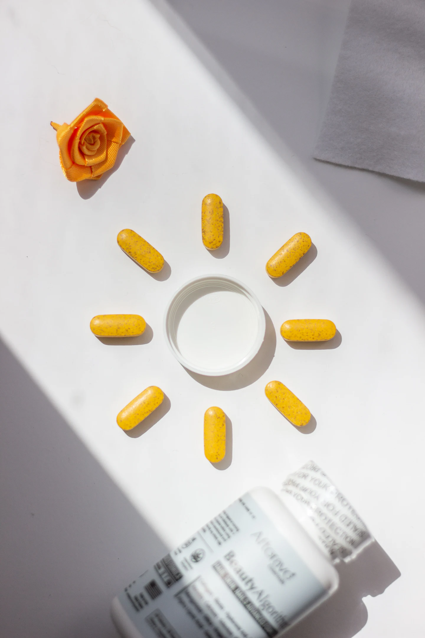 Yellow capsules arranged like rays of the sun