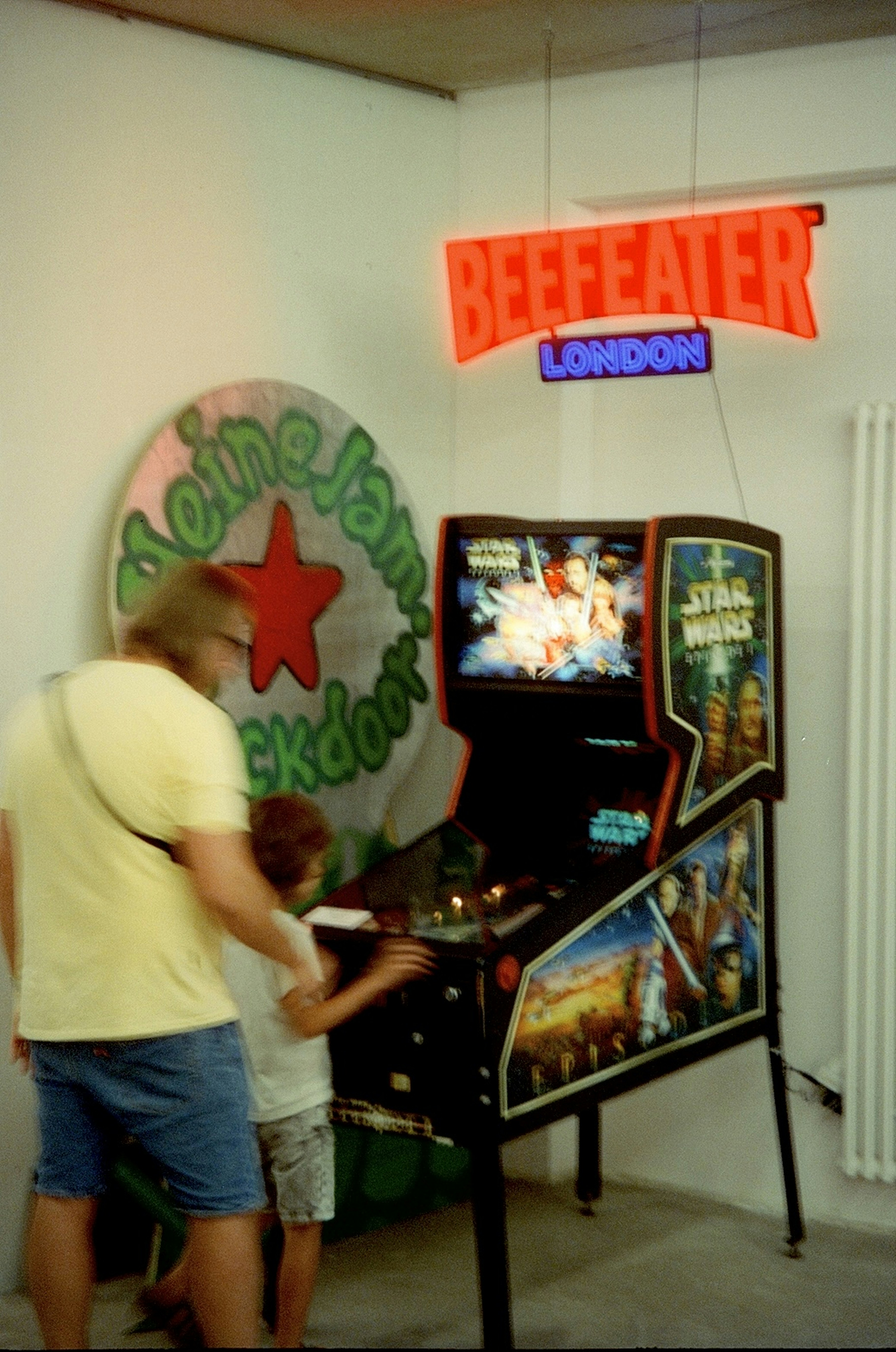 A man and a child playing a video game