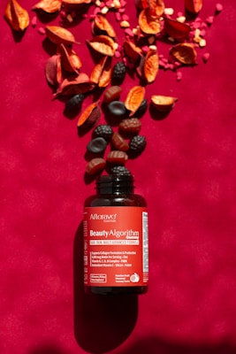 A bottle of vitamin supplement sitting on top of a table