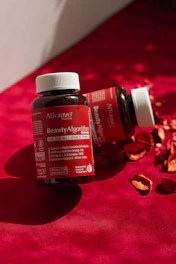 A close up of a bottle of vitamins on a table