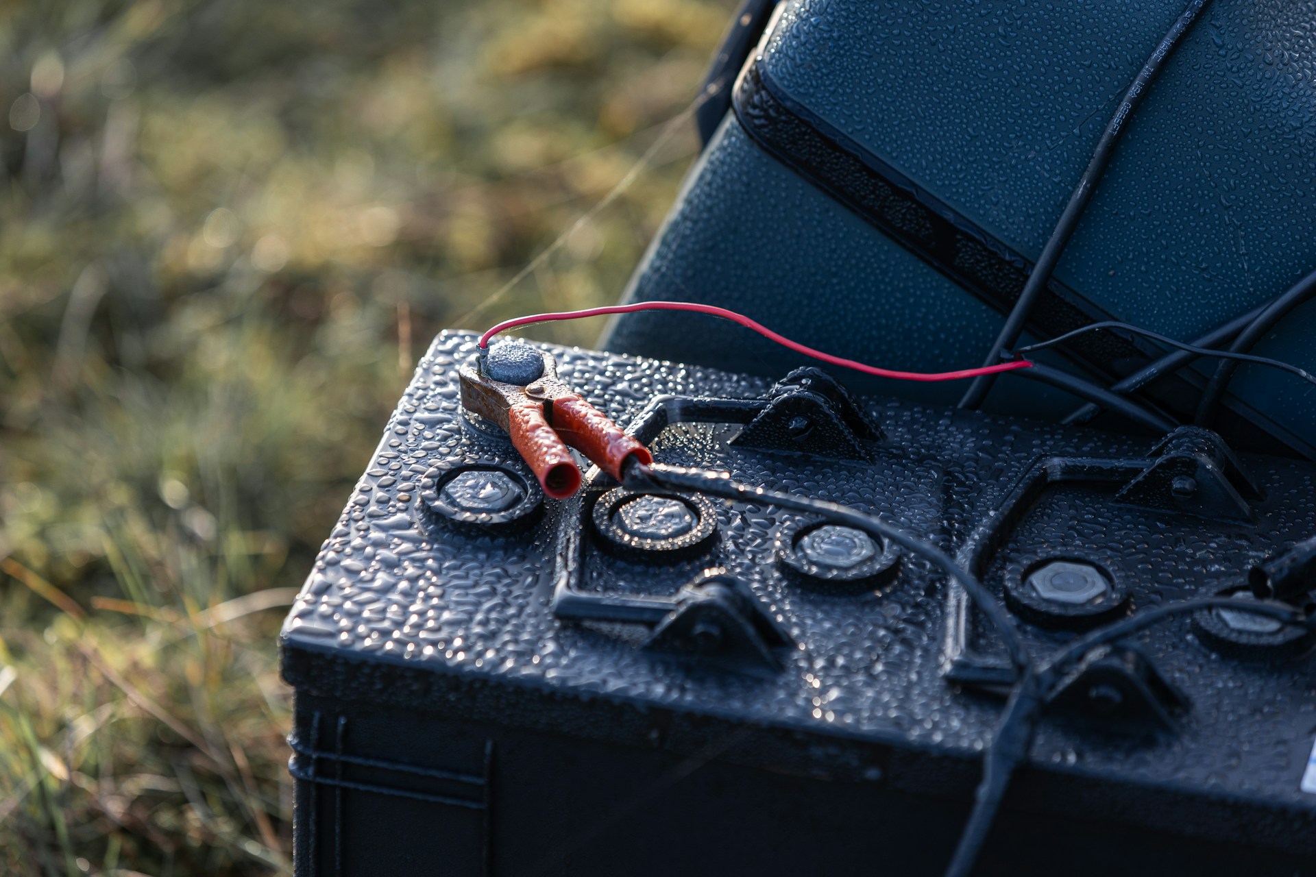 A close up of an electronic device in the grass