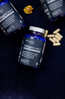 Three bottles of collagen - science sitting on a table