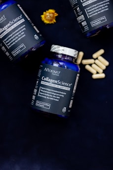 Three bottles of collagen - science sitting on a table