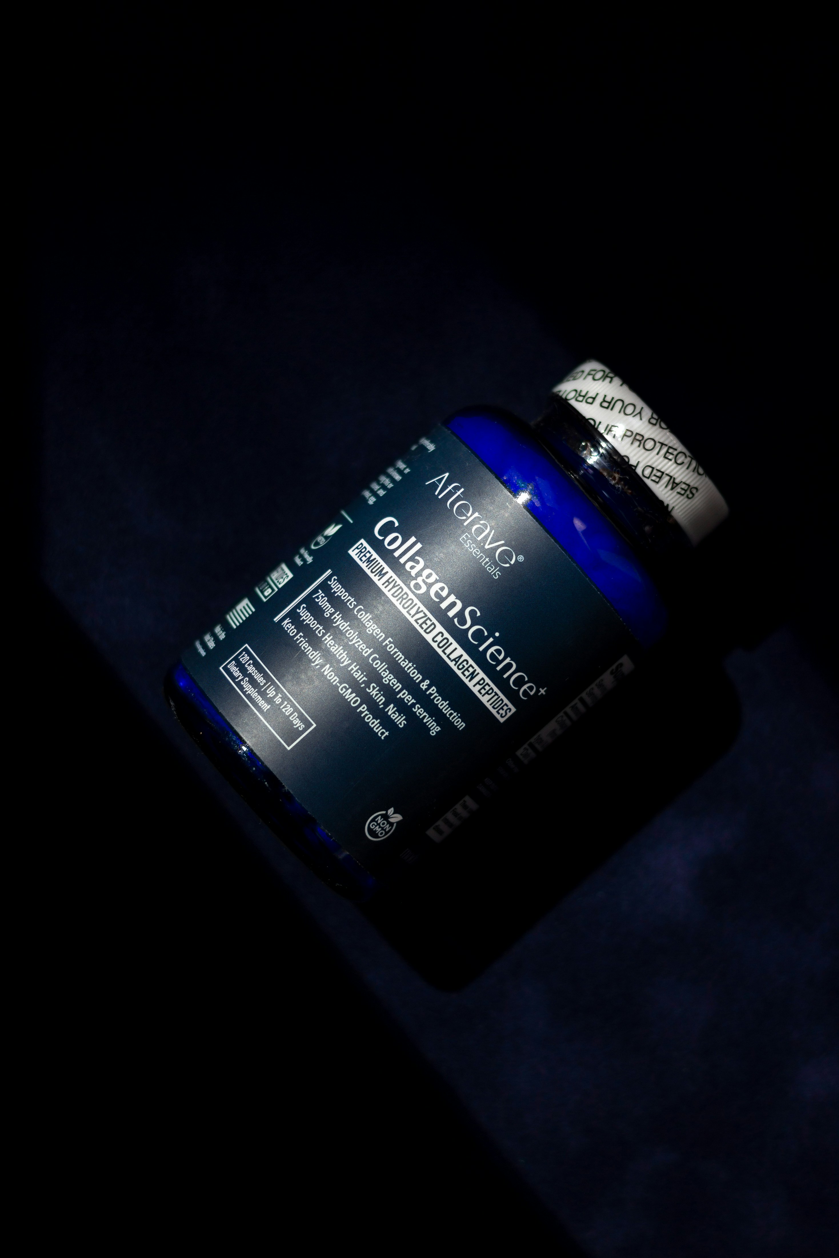 A close up of a bottle of vitamins on a table