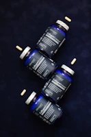 Three bottles of vitamins sitting next to each other