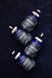 Three bottles of vitamins sitting next to each other