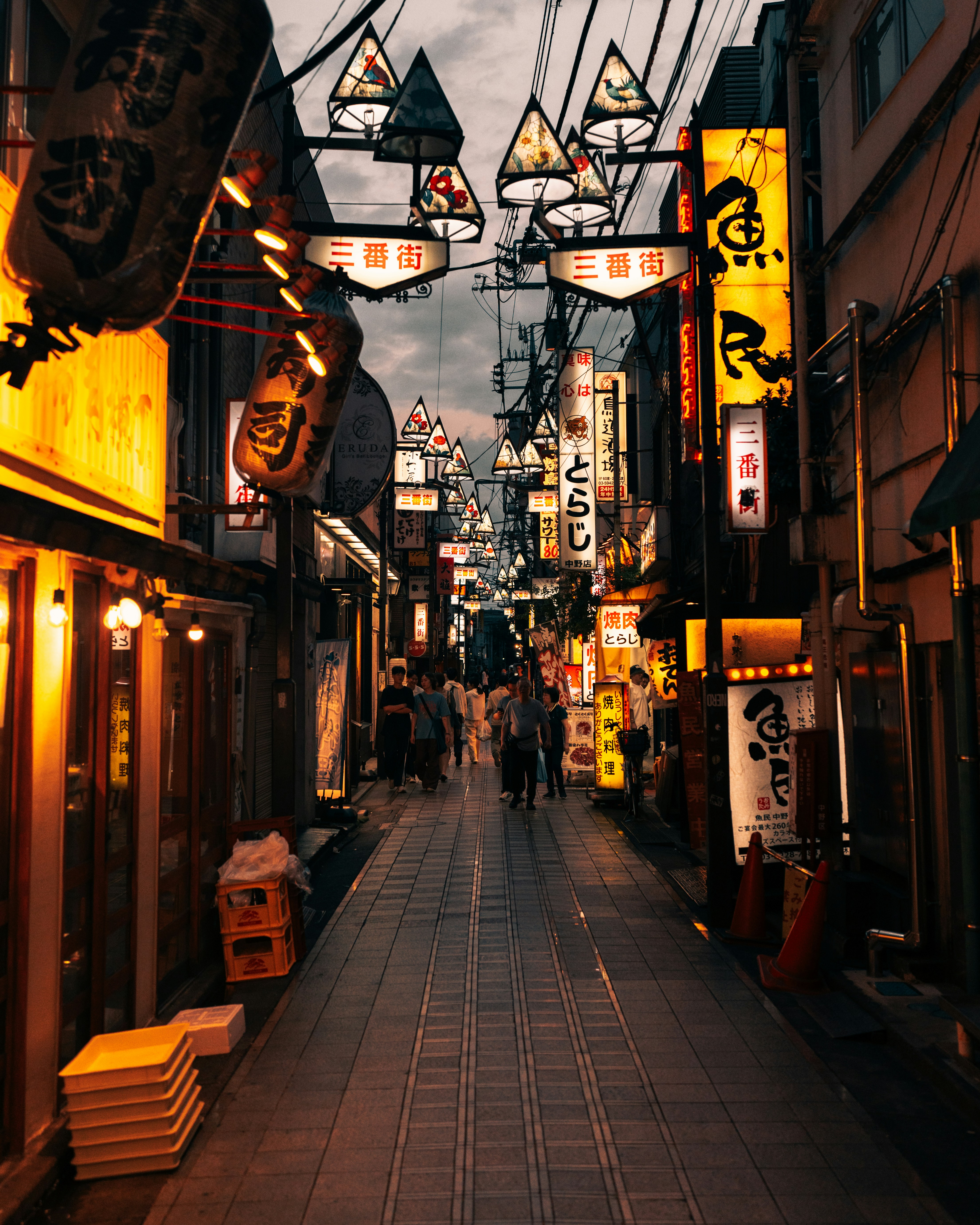 A city street with a lot of signs on the buildings