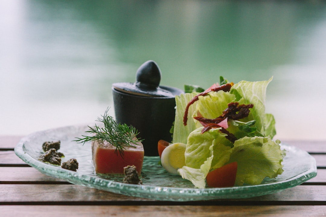 A perfectly cooked salmon fillet with roasted vegetables on a plate.