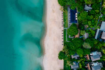 An aerial view of a beach with houses