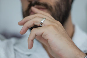 A close up of a person wearing a ring