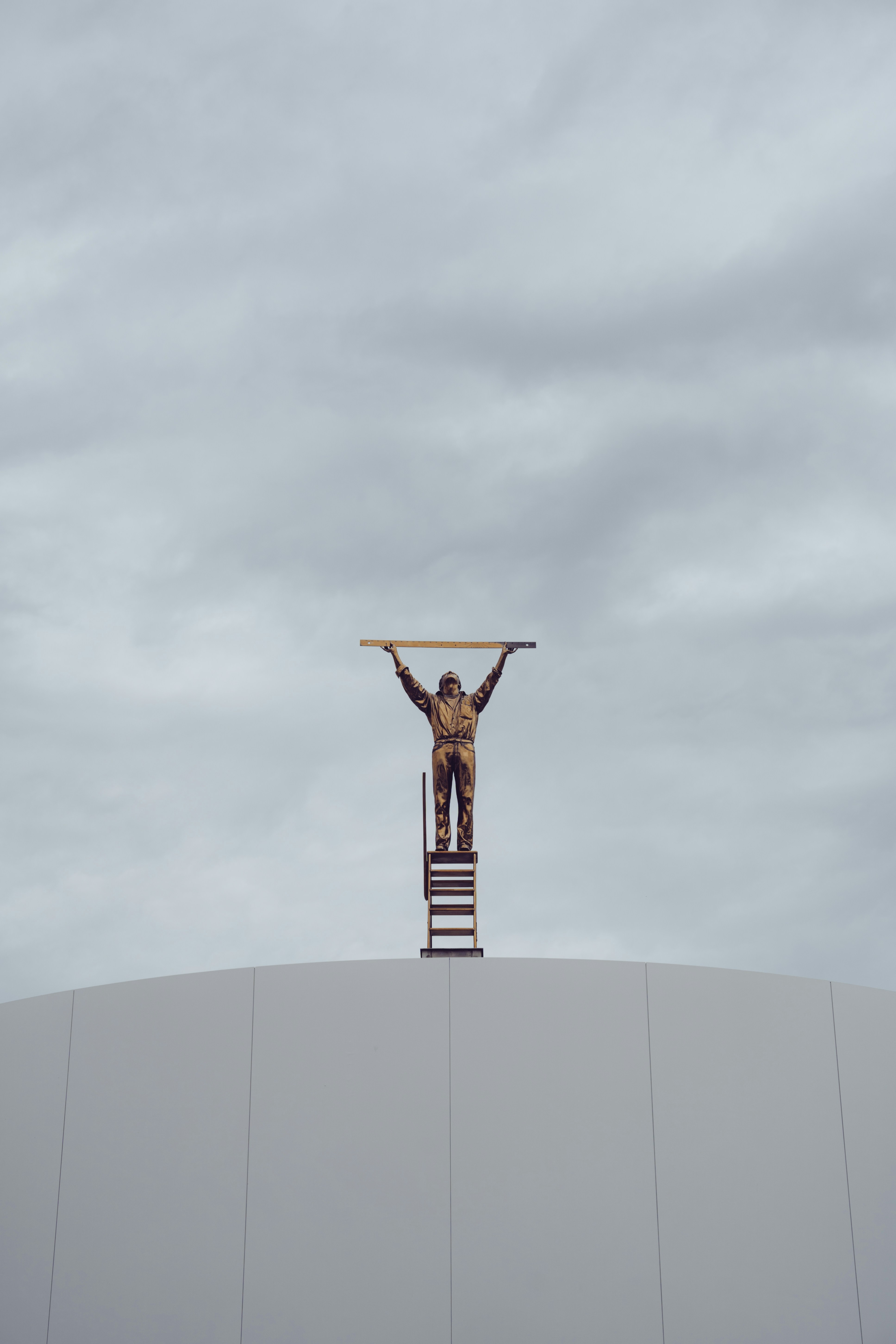 A man standing on top of a tall building