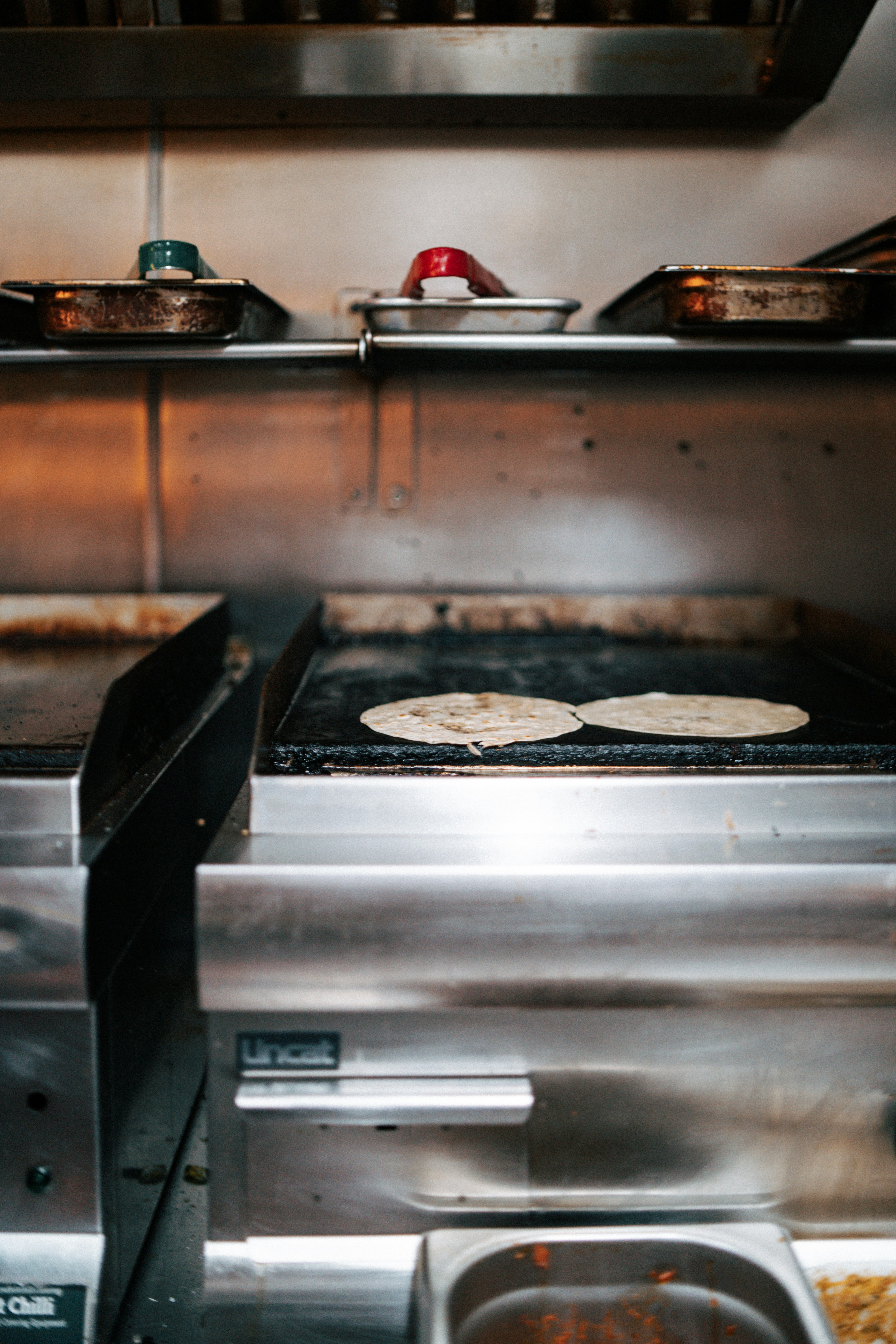 A stove top oven sitting inside of a kitchen