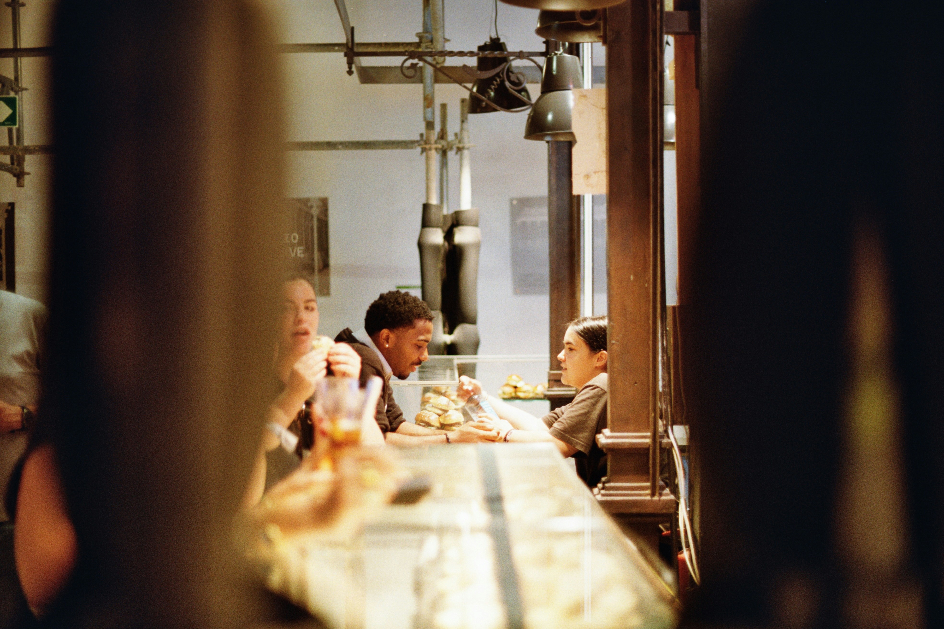 A group of people sitting at a long table