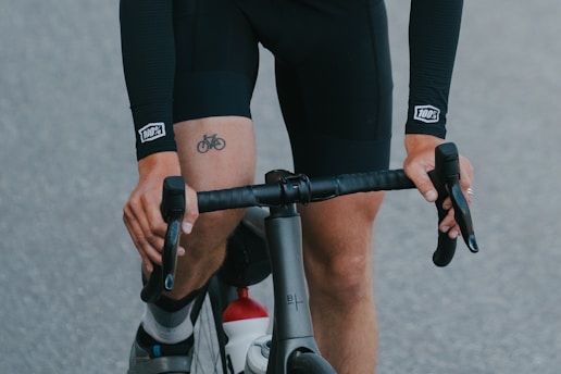 A man riding a bike down a street