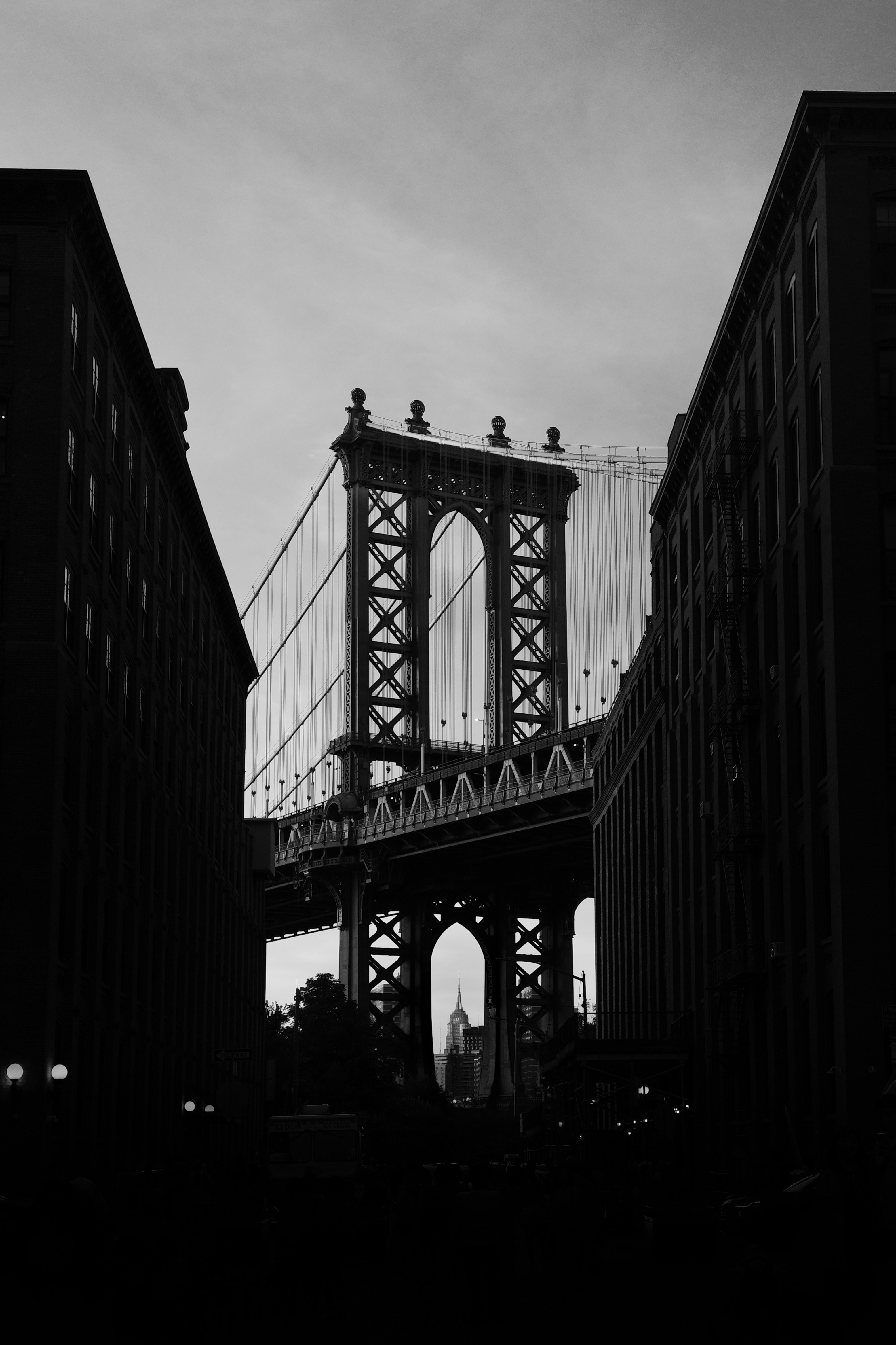 A black and white photo of the brooklyn bridge