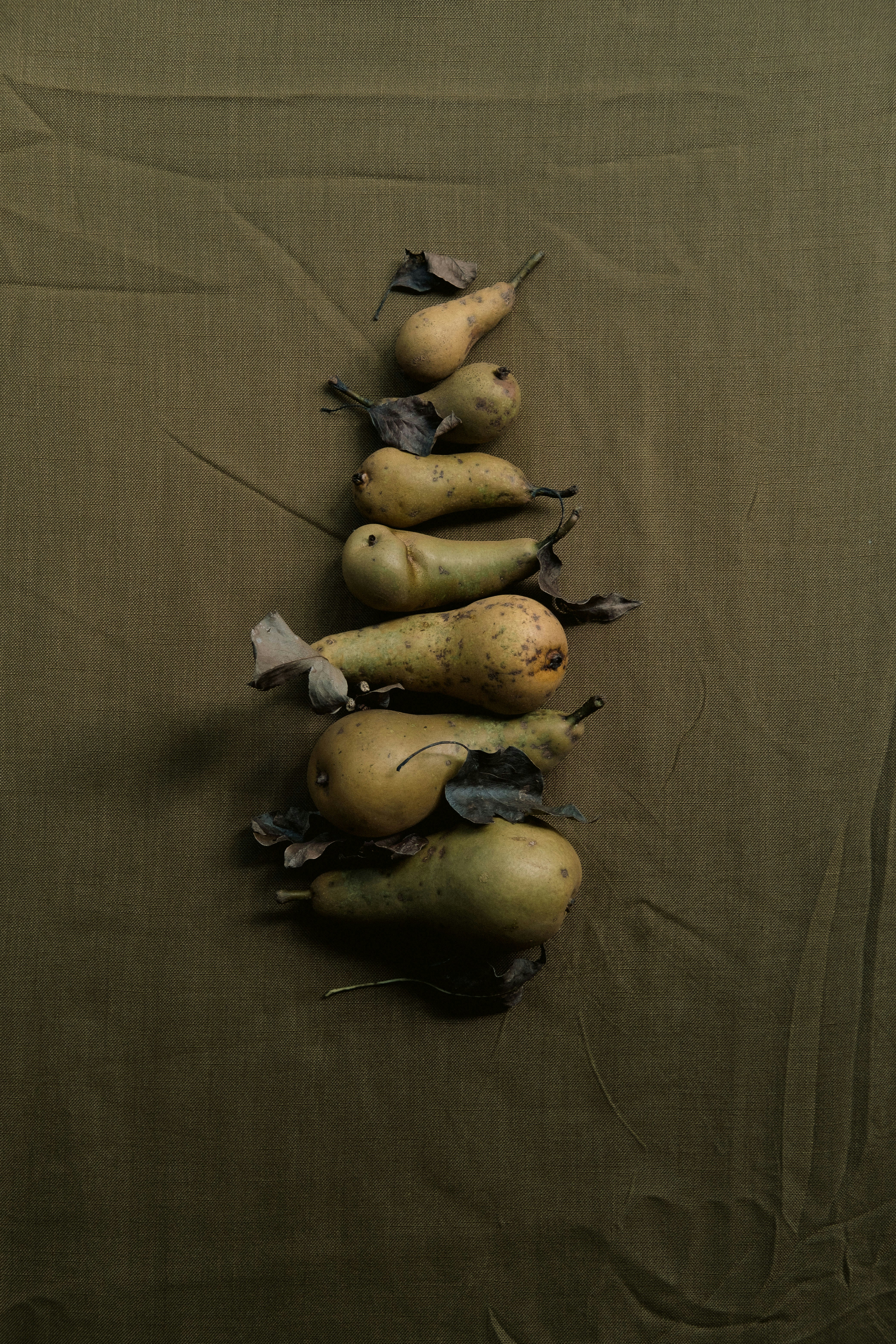 A pile of pears sitting on top of a table