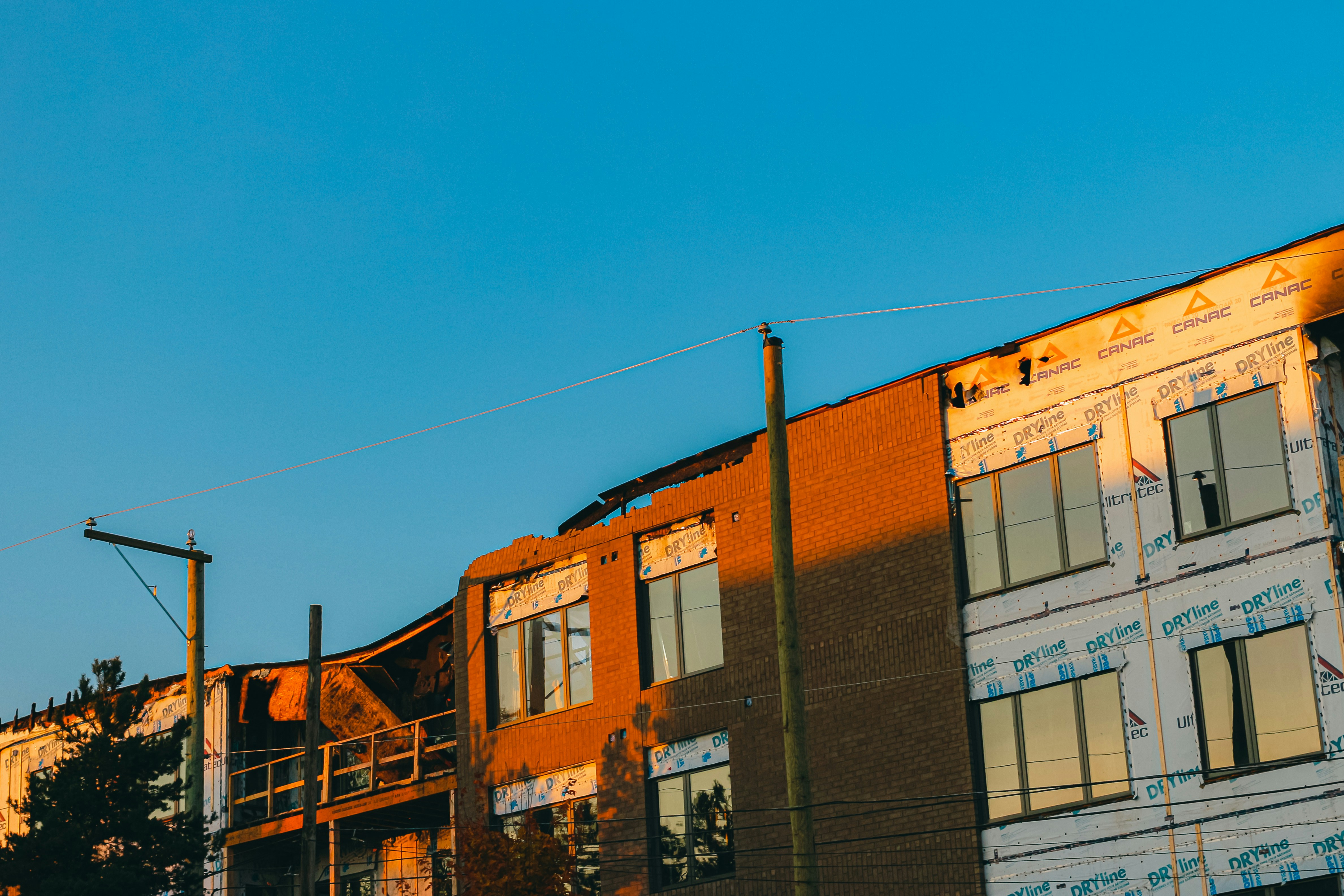 A street sign in front of a multi - story building