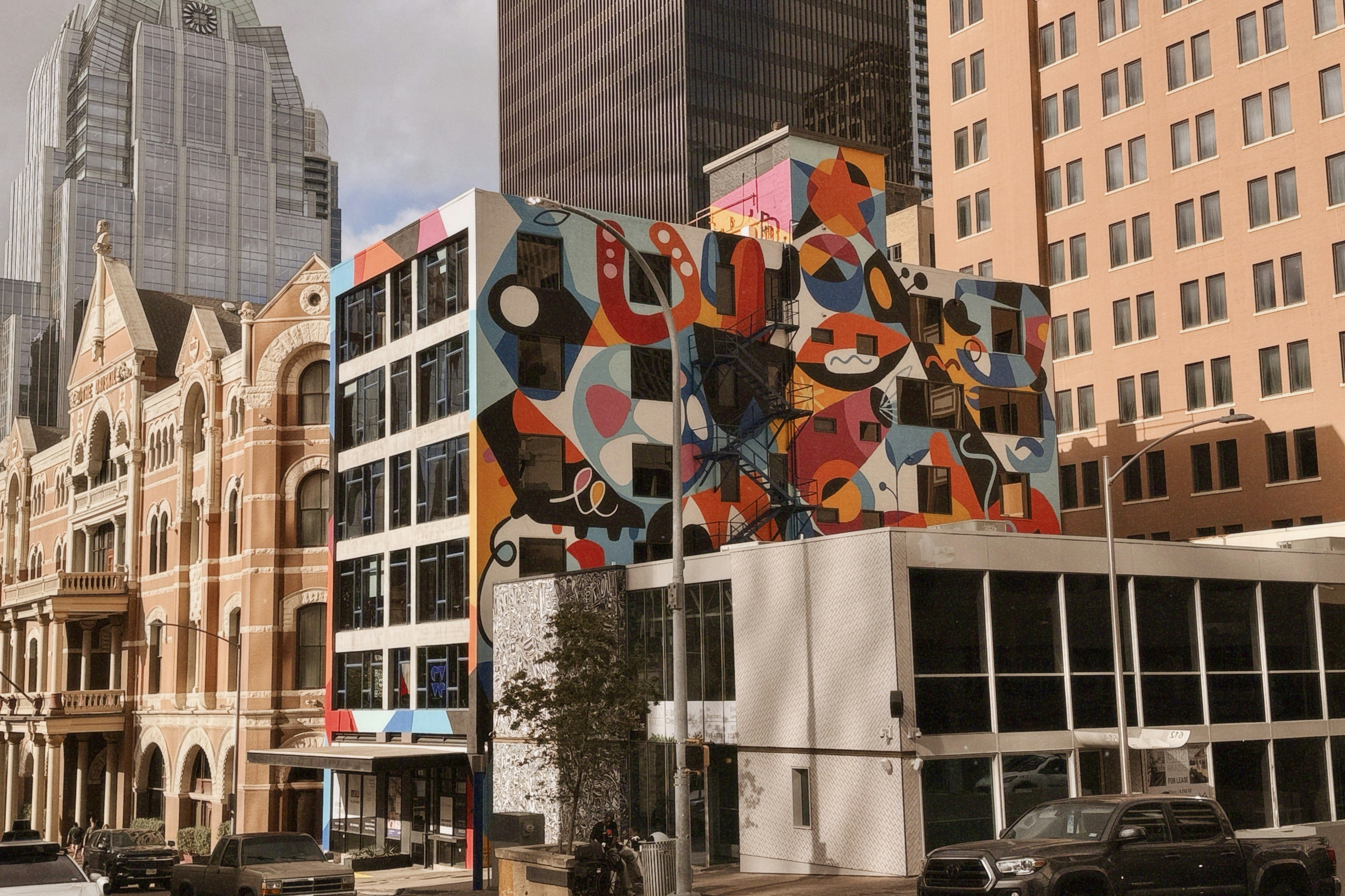 A large building with a colorful mural on it's side