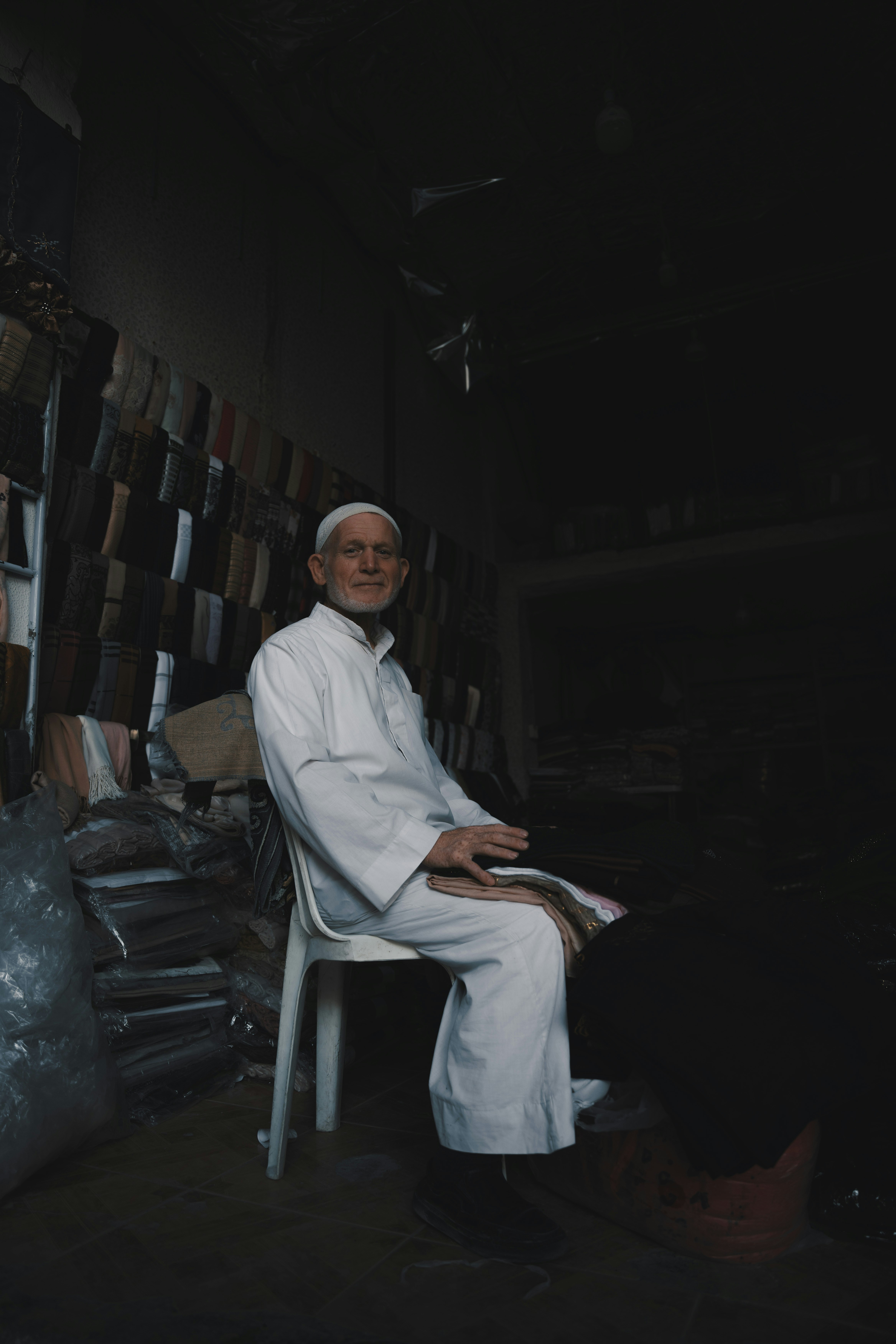 A man sitting on a chair in a room