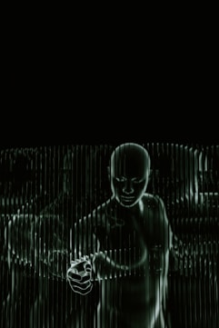 A black and white photo of a person holding a cell phone