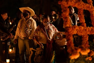 Day of the dead in Mexico A group of people standing next to each other in mexican graveyard