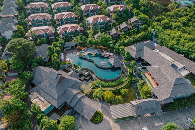 An aerial view of a resort surrounded by trees