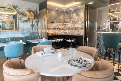 A dining room with a table and chairs