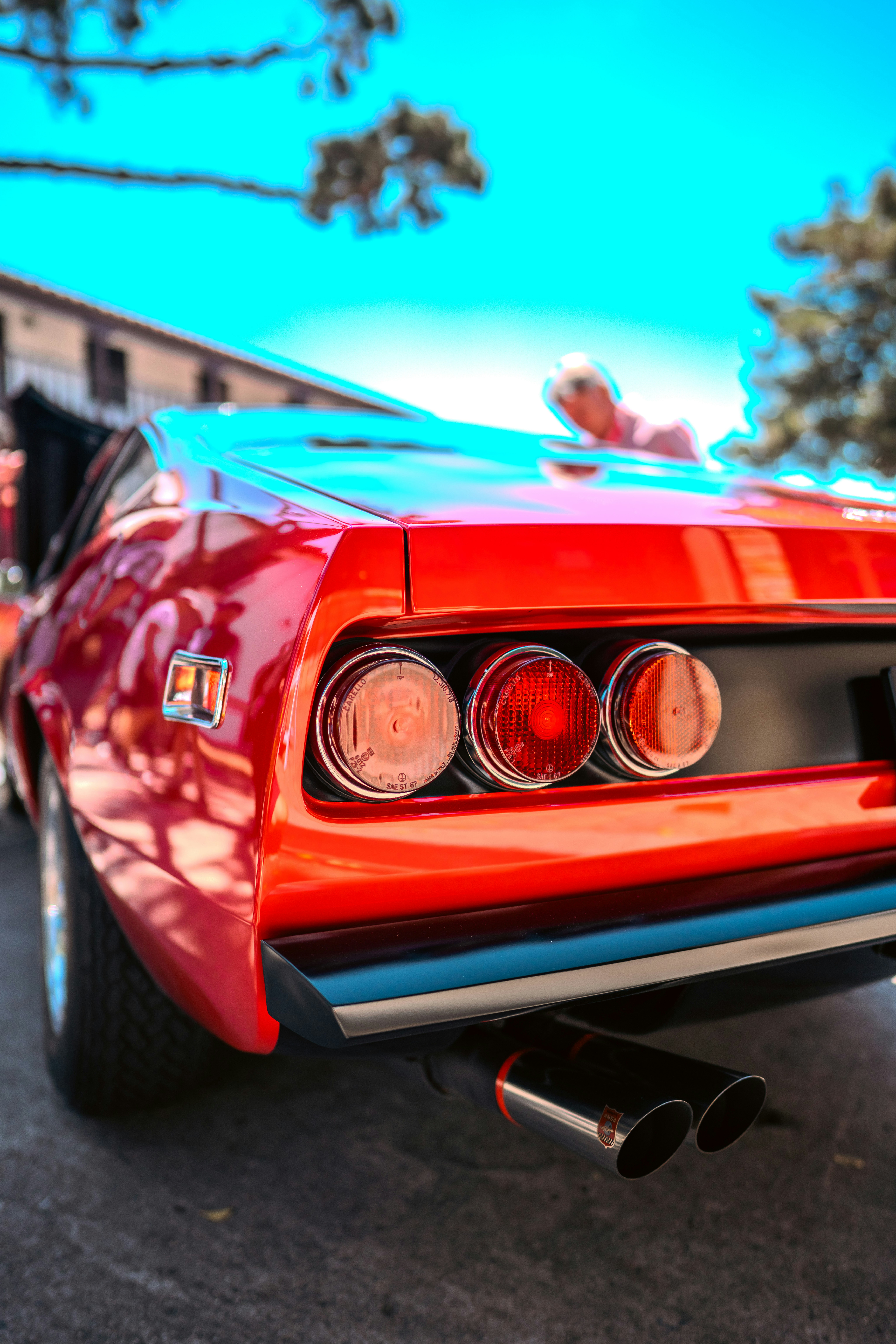 A red car parked on the side of the road
