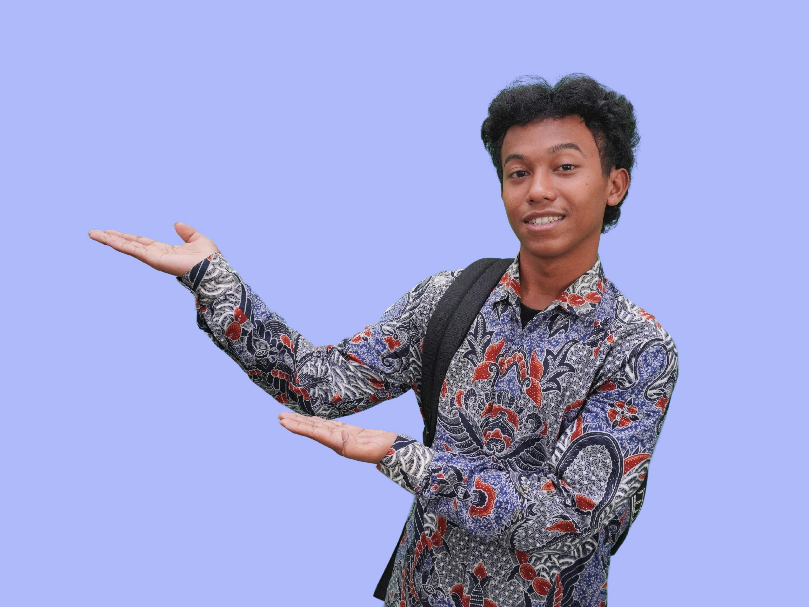 A man with a backpack is holding out his hand