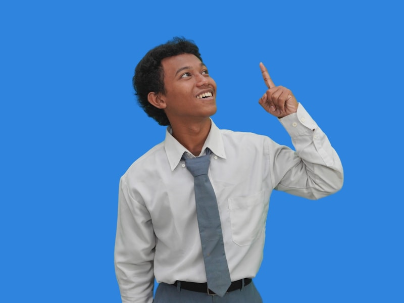Expert professional in formal attire pointing to expertise