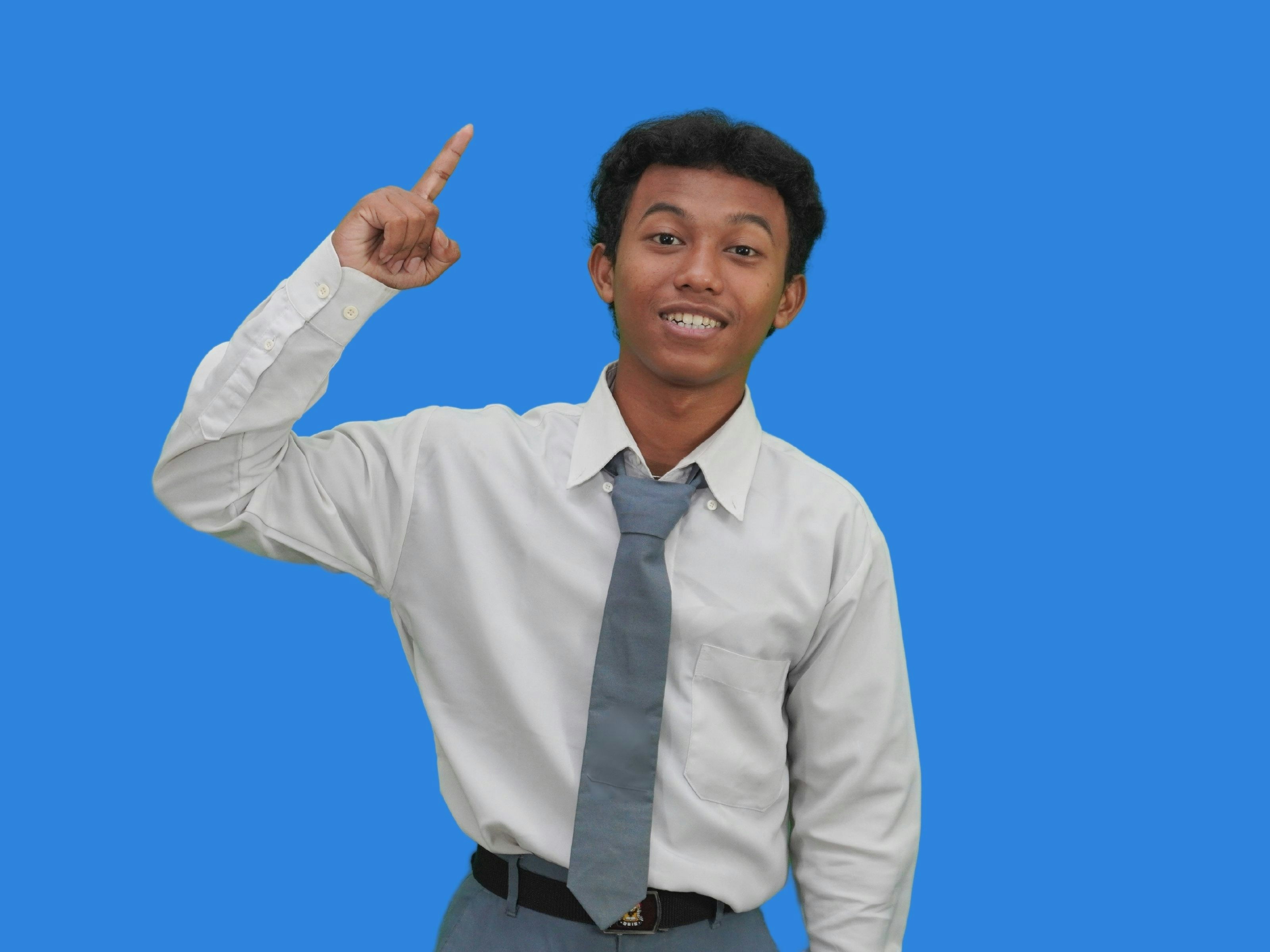 Male Indonesian Public School Highschoolers Smiling Pointing Up