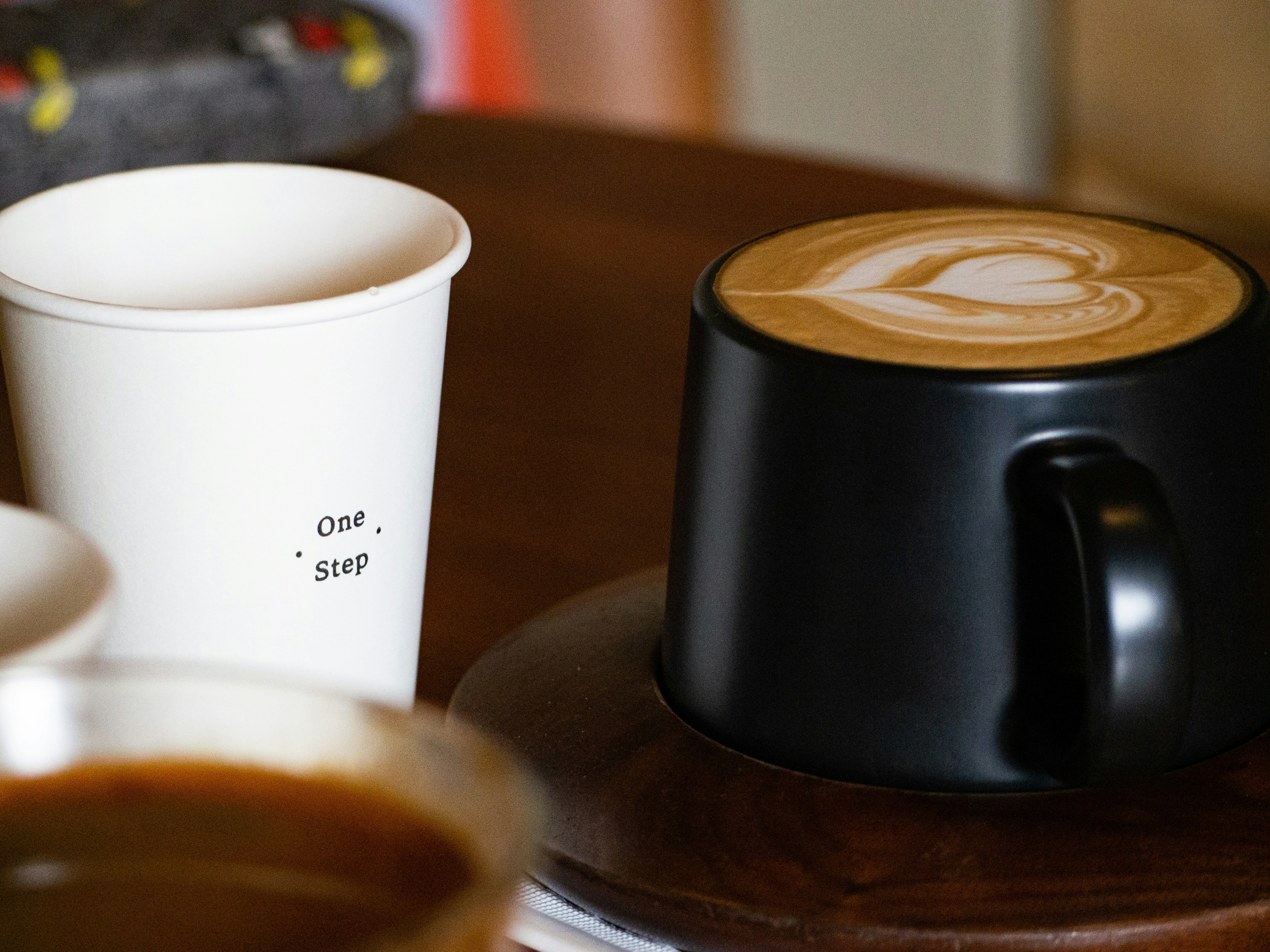 Two cups of coffee on wooden table