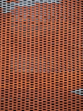 A close up of an orange and grey mesh