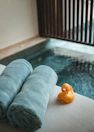 A couple of towels sitting next to a pool