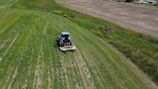 An aerial view of a tractor in a field