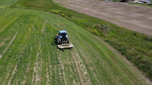 An aerial view of a tractor in a field