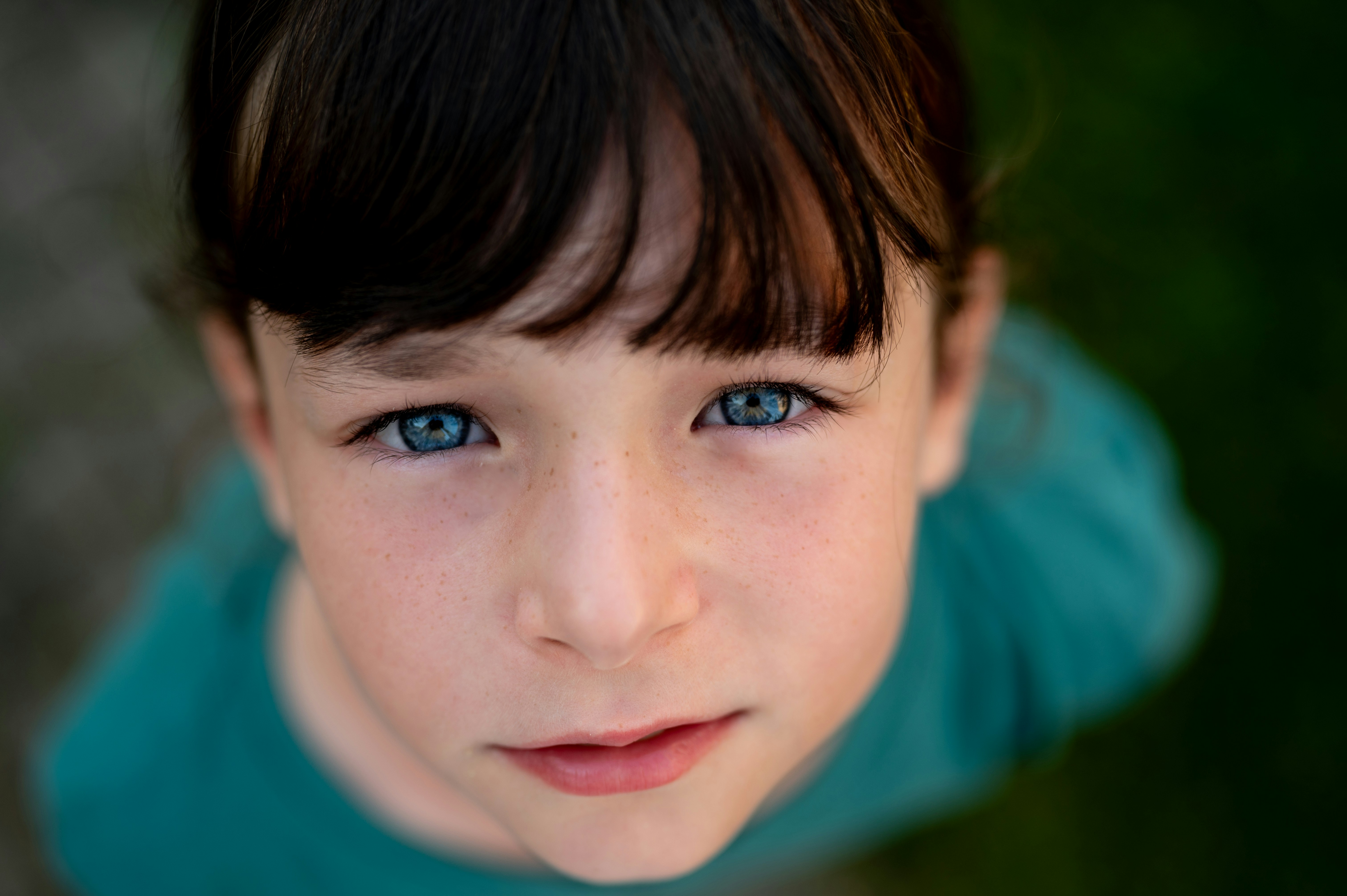 A close up of a child with blue eyes