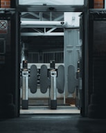 A train station entrance with a clock on the wall