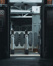 A train station entrance with a clock on the wall