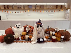 A group of stuffed animals sitting on top of a counter
