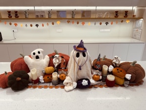 A group of stuffed animals sitting on top of a counter