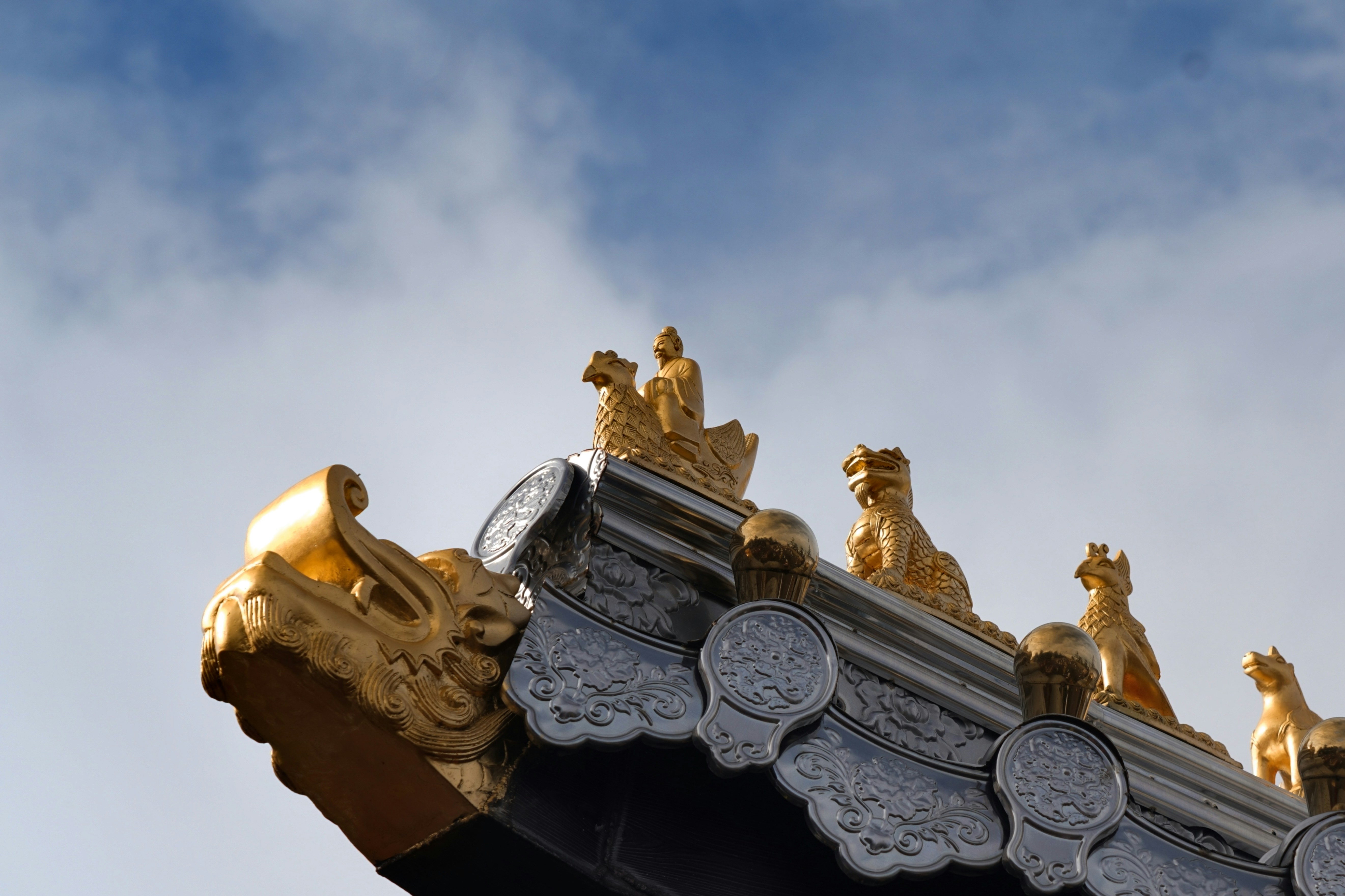 A close up of a roof with a clock on it