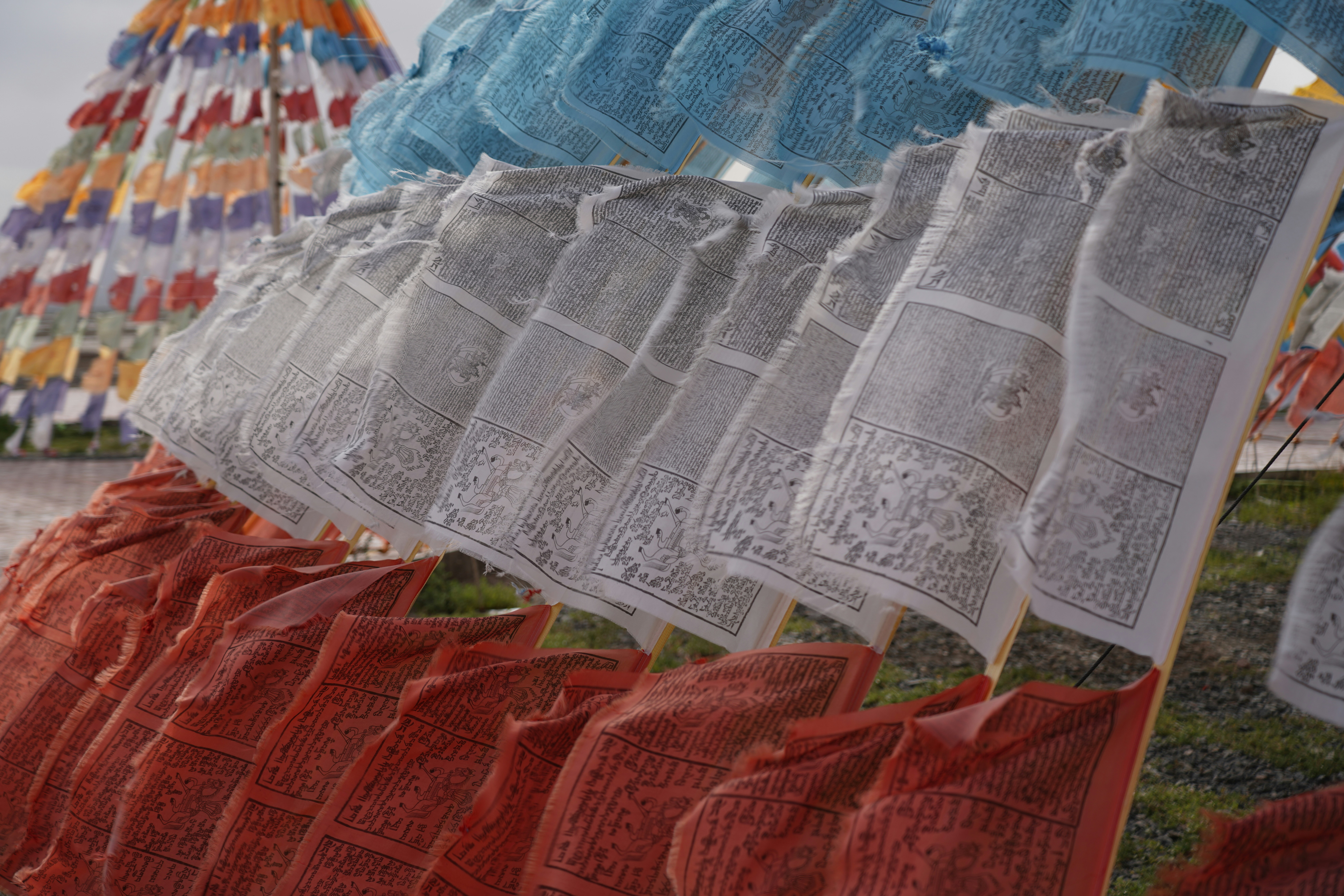 A row of colorful umbrellas sitting next to each other