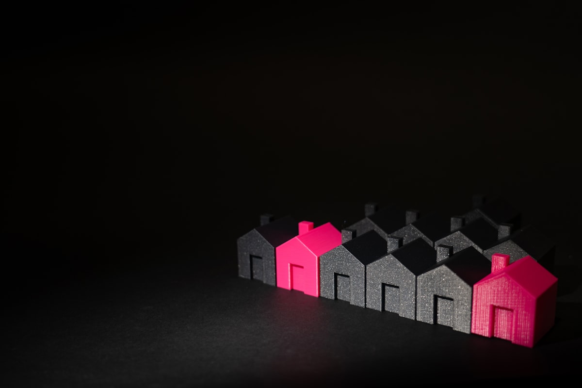 Row of small model houses on a table representing Phoenix comparable home sales