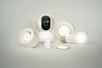 A camera sitting on top of a pile of white objects