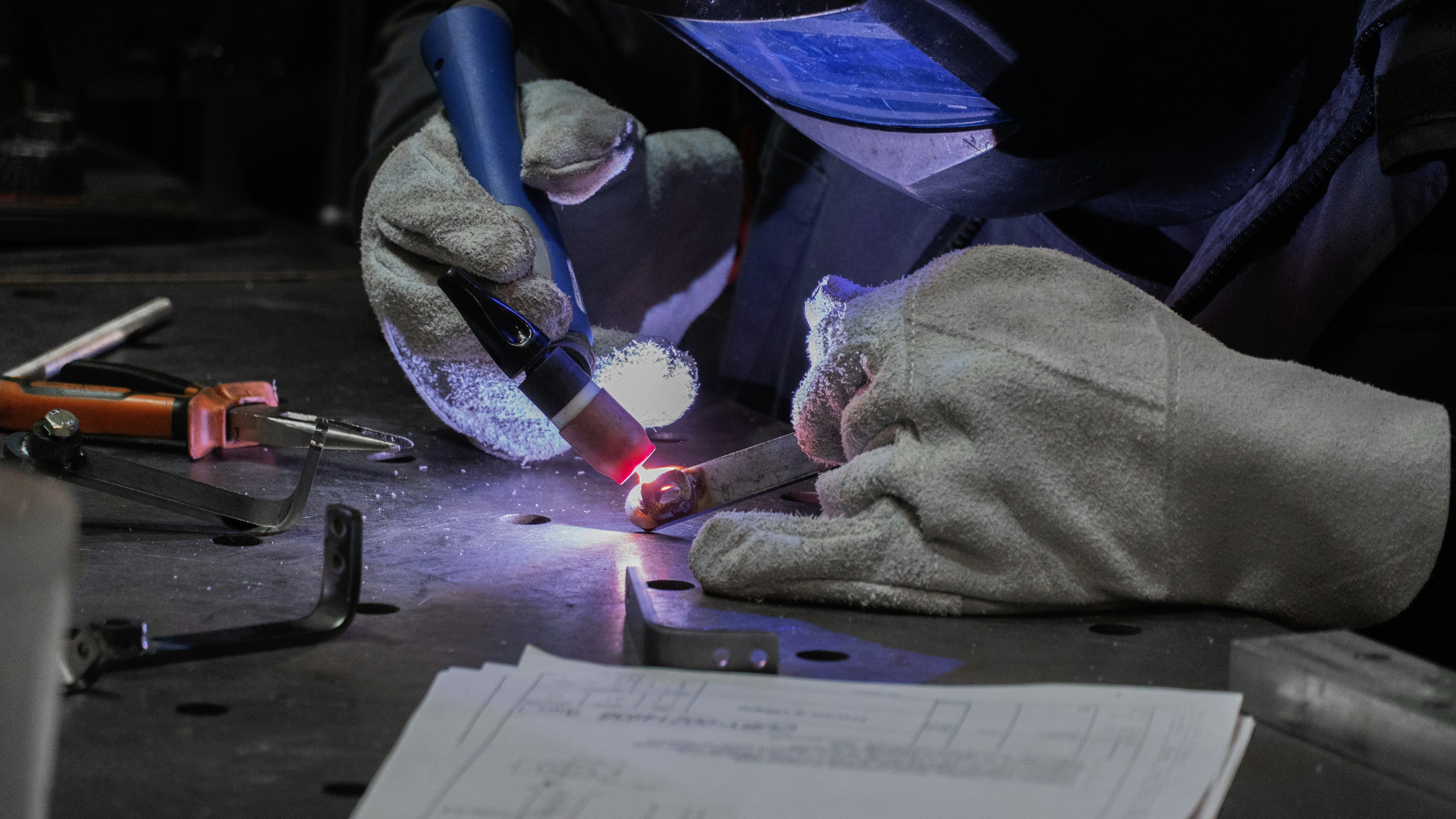 A man working on a piece of metal